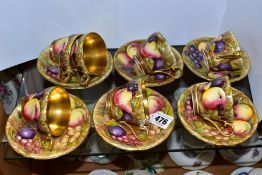 A SET OF SEVEN AYNSLEY ORCHARD GOLD CABINET COFFEE CUPS AND SAUCERS, pattern no. 746, all bearing
