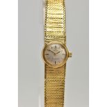 A LADIES 9CT GOLD 'OMEGA' WRISTWATCH, a hand wound movement, round silver tone dial signed 'Omega