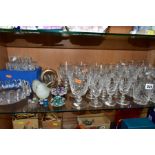 A GROUP OF CUT CRYSTAL DRINKING GLASSES AND OTHER GLASSWARES, to include five sets of stemware and