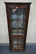 A SLIM OLD CHARM OAK LEAD GLAZED TWO DOOR DISPLAY CABINET, with four glass shelves width 61cm x