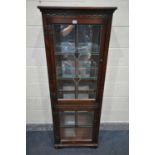 A SLIM OLD CHARM OAK LEAD GLAZED TWO DOOR DISPLAY CABINET, with four glass shelves width 61cm x