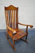 A MID TO LATE 20TH CENTURY HARDWOOD AND BRASS INLAID ROCKING CHAIR