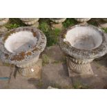 A PAIR OF COMPOSITE CAMPAGNA GARDEN URN, on a square plinth, diameter 52cm x height 56cm (