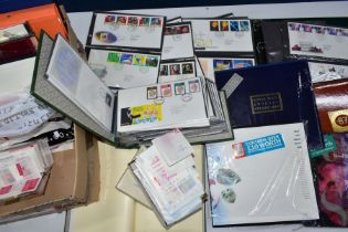 COLLECTION OF STAMPS in a box with GB FDCs and mint GB in packets and yearbooks providing good