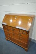 A GEORGIAN OAK AND FAN INLAID BUREAU, enclosing a fitted interior, and an arrangement of seven