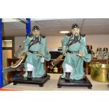 A PAIR OF MODERN JAPANESE POTTERY FIGURES OF SAMURAI WARRIORS, posed holding bladed staff which is