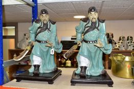 A PAIR OF MODERN JAPANESE POTTERY FIGURES OF SAMURAI WARRIORS, posed holding bladed staff which is