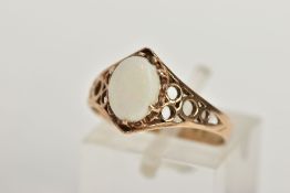 A 9CT GOLD OPAL RING, designed with an oval opal cabochon in a six claw setting, openwork detailed