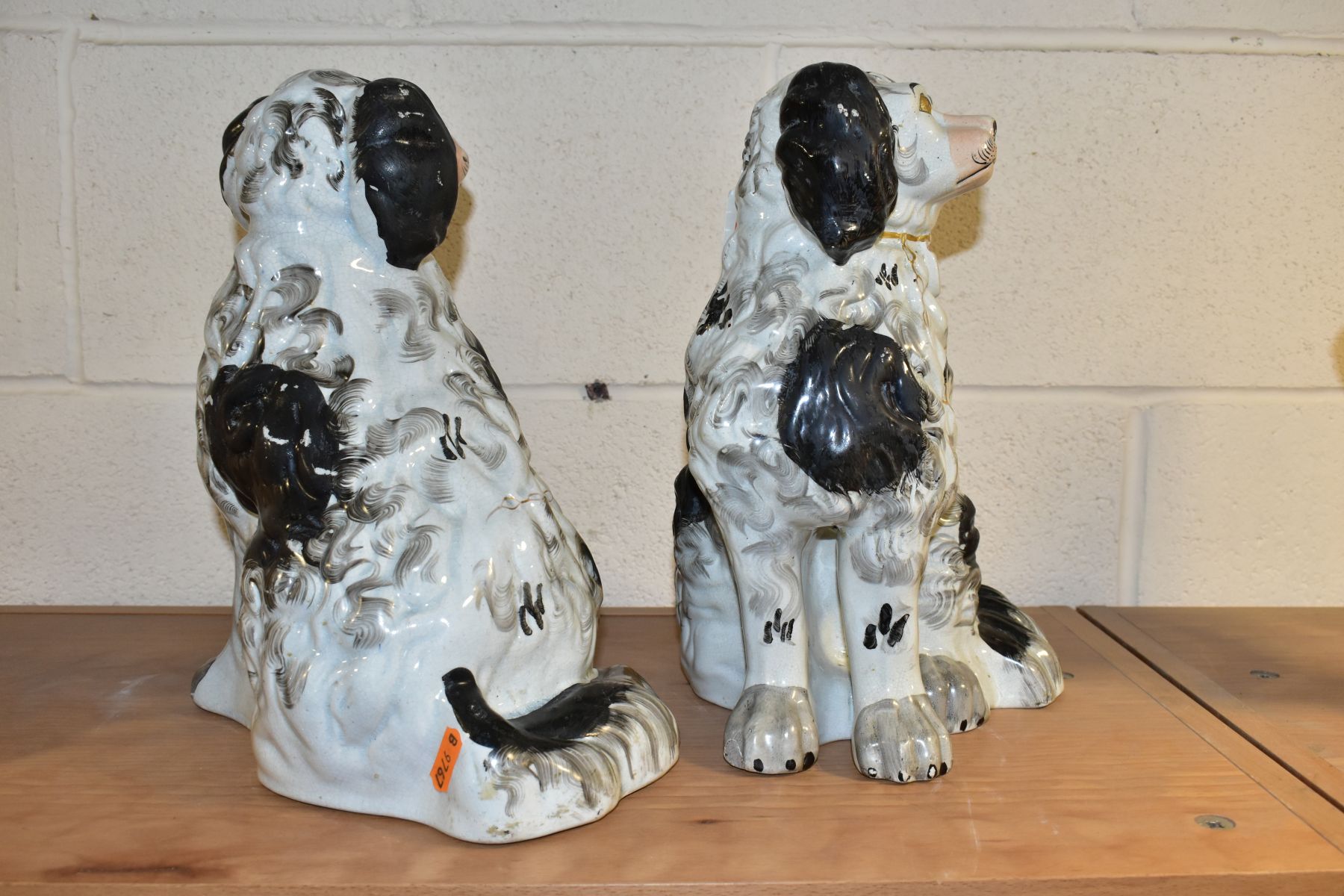 A PAIR OF VICTORIAN STAFFORDSHIRE POTTERY CURLY COATED BLACK AND WHITE SEATED SPANIELS, one - Bild 4 aus 6