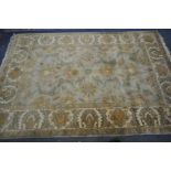 A G H FRITH WOLLEN INDU ZEIGLER GREEN AND CREAM RUG, 272cm x 183cm (condition:-some minor staining)