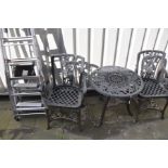 A PLASTIC CIRCULAR GARDEN TABLE, diameter 68cm x height 65cm and two armchairs, along with three