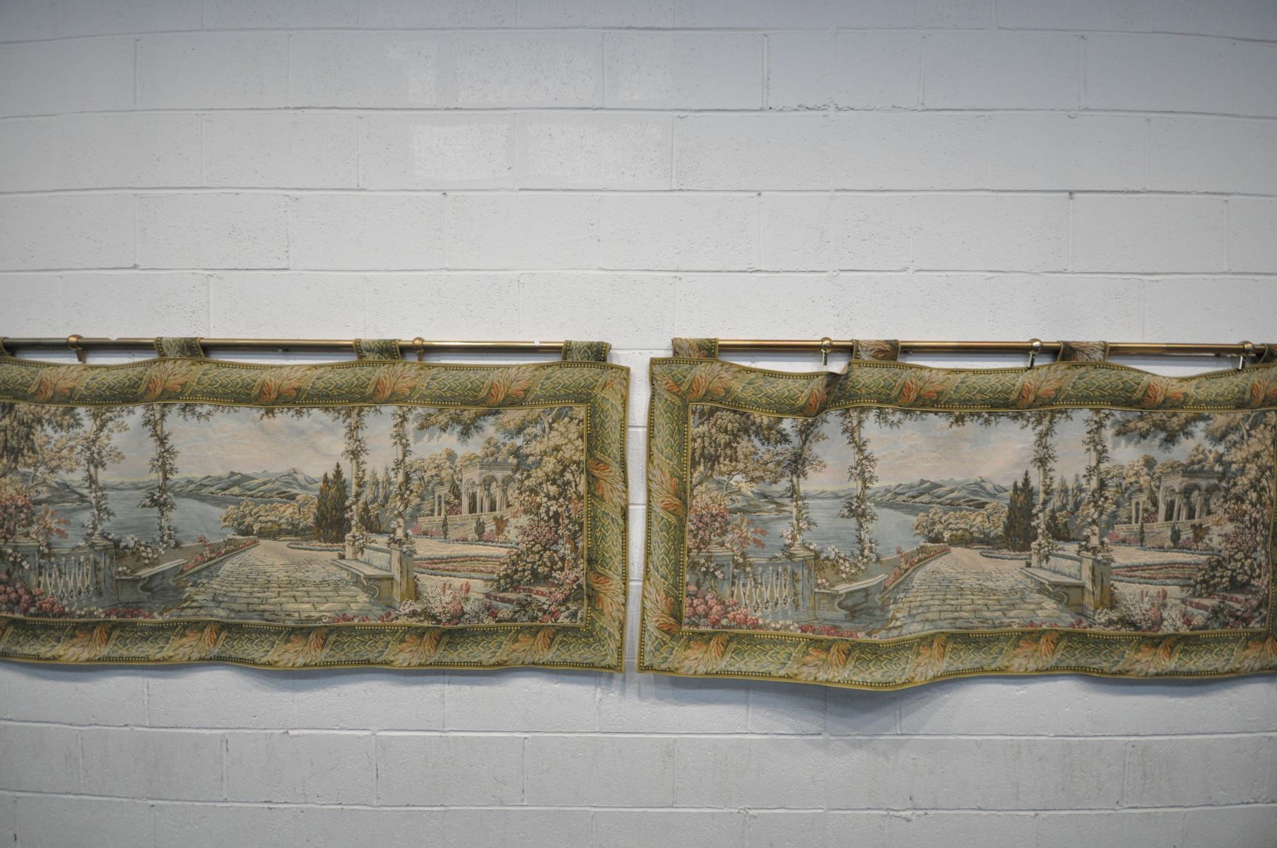 A PAIR OF MODERN MACHINE MADE ITALIANATE SCENE TAPESTRIES, with floral border, length 200cm x height