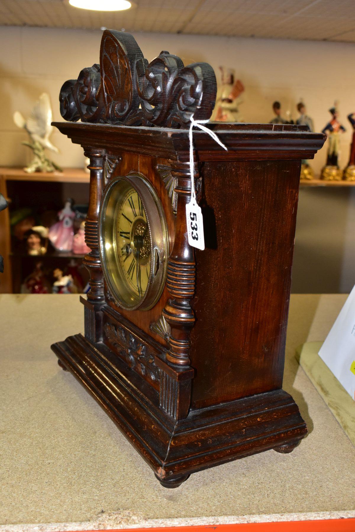 A LATE 19TH CENTURY WALNUT AND STAINED MANTEL CLOCK, foliate carved pediment, printed dial with - Bild 2 aus 6