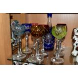 A BOHEMIAN GLASS CUT TO CLEAR DECANTER WITH EIGHT HOCK GLASSES, comprising a cobalt blue cut to
