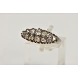 AN OLD CUT DIAMOND DRESS RING, the graduated old cut diamond rows, with openwork gallery and tapered