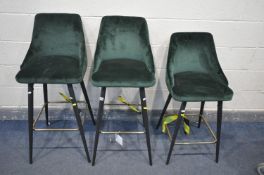 THREE GREEN VELVET BAR STOOLS, on metal legs, two at 109cm x one at 97cm (condition - some marks