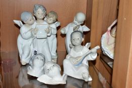 THREE LLADRO FIGURES AND TWO LLADRO WALL MASKS, comprising 'Angel's Group', three angels singing