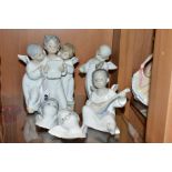 THREE LLADRO FIGURES AND TWO LLADRO WALL MASKS, comprising 'Angel's Group', three angels singing