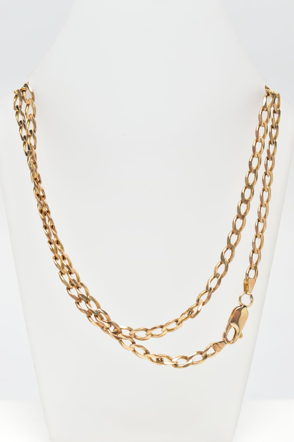 A 9CT GOLD CURB LINK CHAIN, the flat curb links to the lobster clasp, import hallmark for