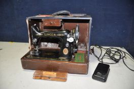 A SINGER SEWING MACHINE with foot pedal and light in blue case (PAT pass and working)