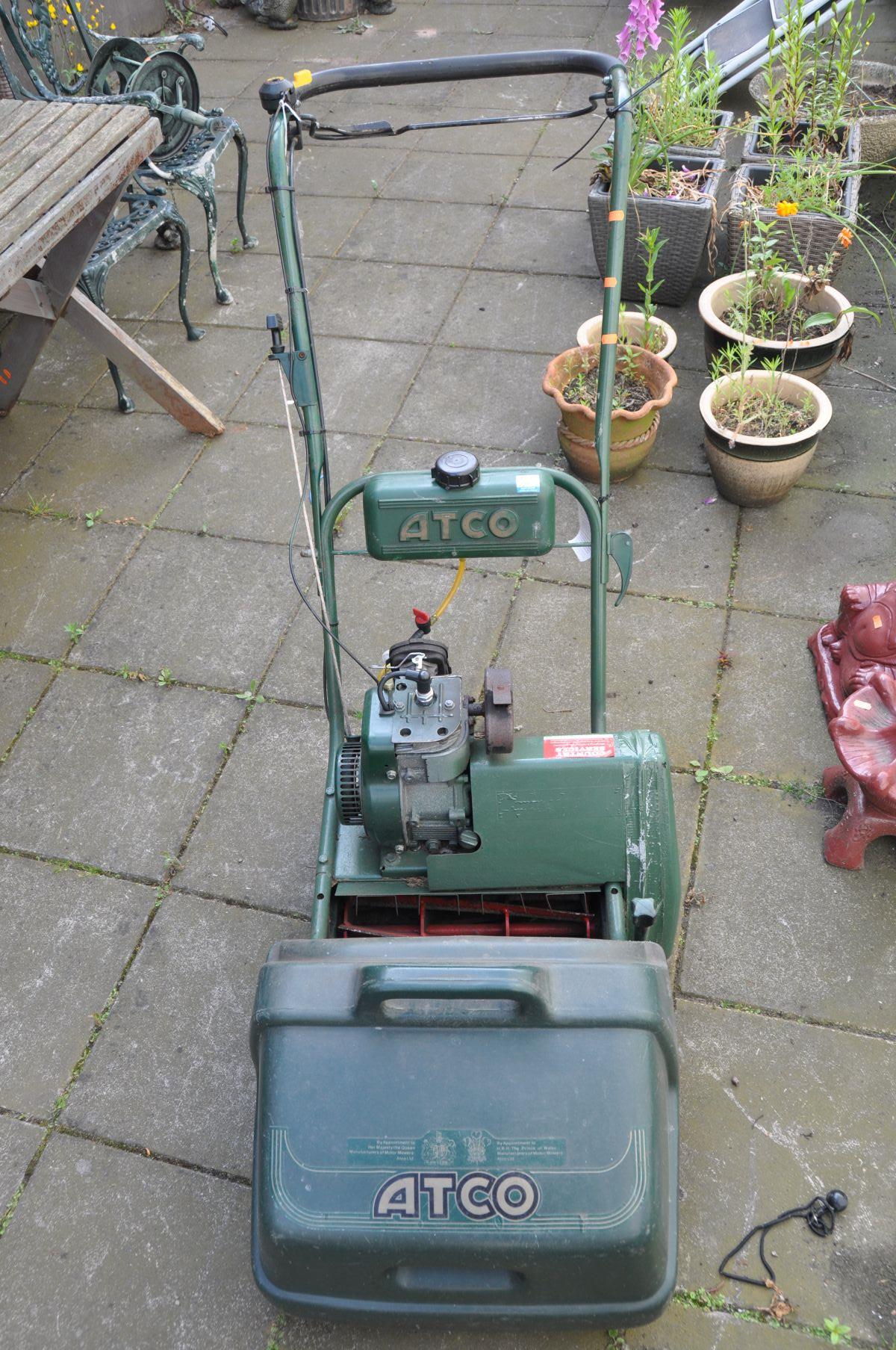 AN ATCO PETROL CYLINDER LAWNMOWER with grass box (engine turns freely)
