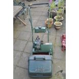 AN ATCO PETROL CYLINDER LAWNMOWER with grass box (engine turns freely)