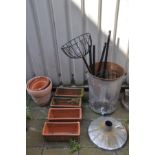 A SET OF FOUR TERRACOTTA RECTANGULAR PLANTERS, and two circular terracotta planters, along with a
