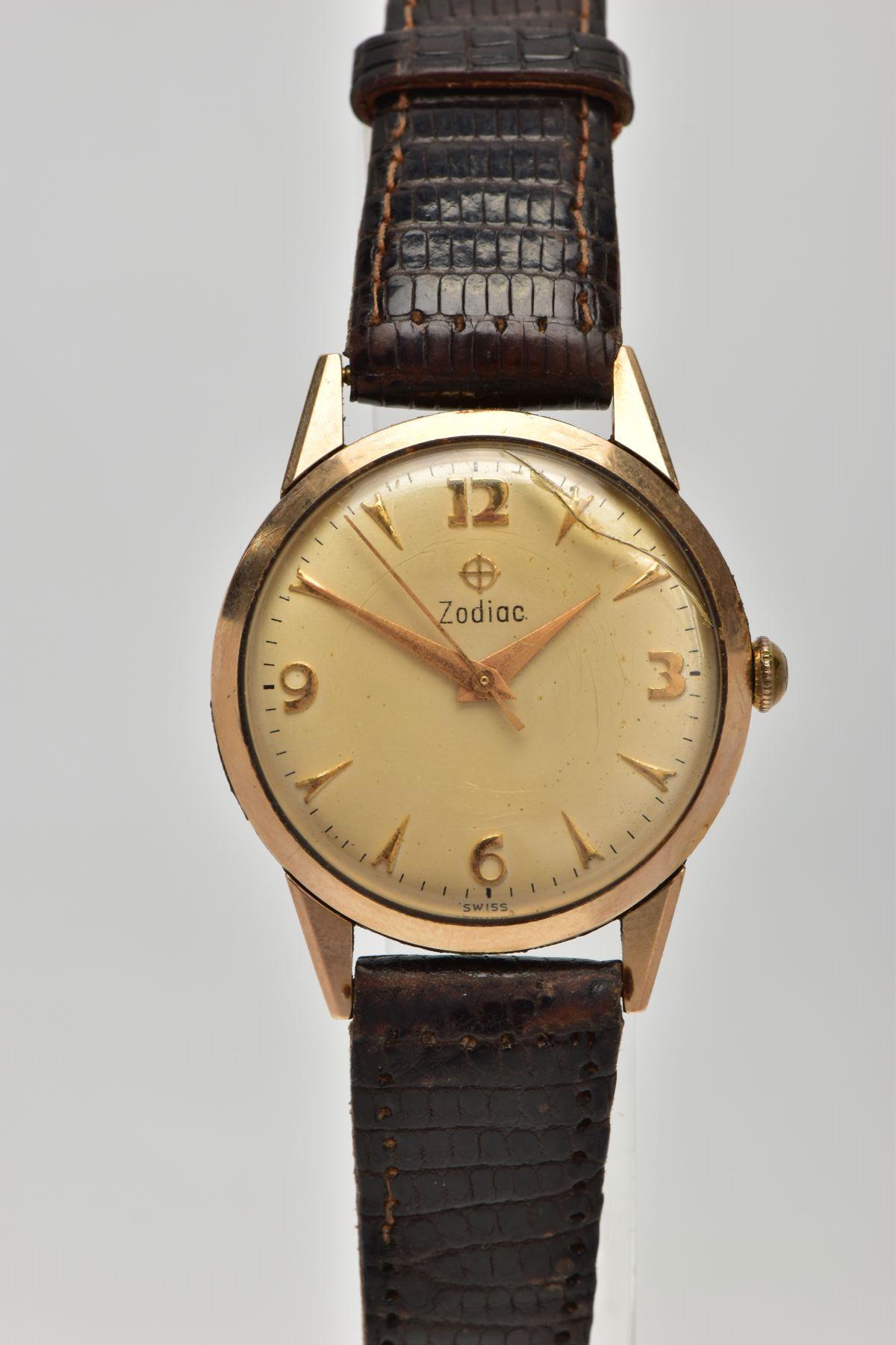 A 9CT GOLD 'ZODIAC' WRISTWATCH, hand wound movement (non-running), round gold tone dial signed '