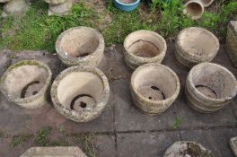 A SET OF FOUR COMPOSITE BARREL TYPE CIRCULAR PLANTERS, diameter 30cm x height 21cm, along with a