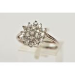 A 9CT WHITE GOLD BRILLIANT-CUT DIAMOND CLUSTER RING, with nineteen graduated diamonds to the