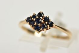 A 9CT GOLD SAPPHIRE CLUSTER RING, tiered cluster of a navette shape, set with nine circular cut deep