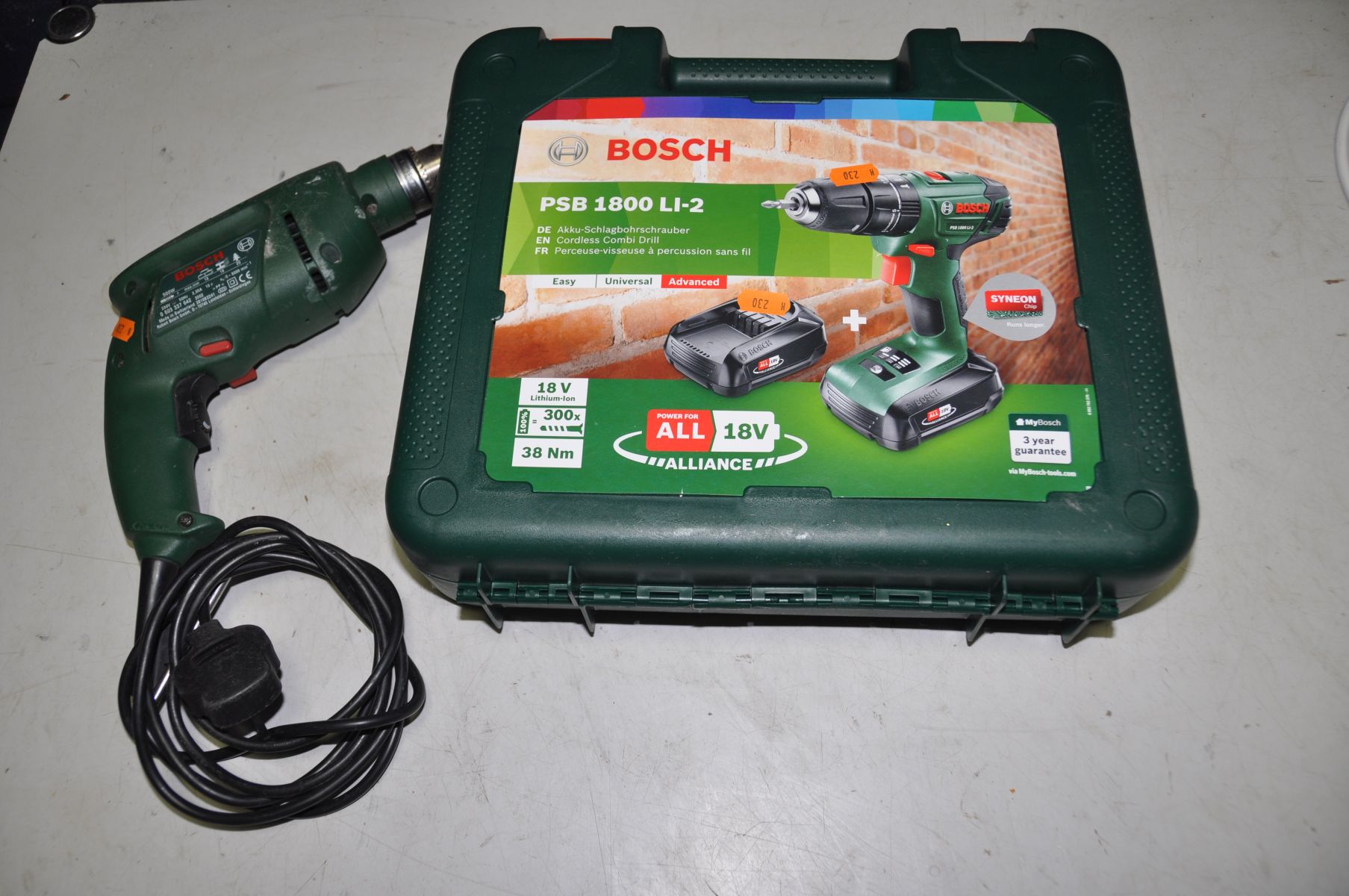 A BOXED BOSCH PSB 1800 LI-2 CORDLESS DRILL, with two chargers and charger (PAT pass, working, and