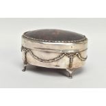 AN EARLY 20TH CENTURY SILVER AND TORTOISESHELL HINGED BOX, the oval trinket box with embossed