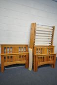 TWO PINE SINGLE BEDSTEADS, both with side rails and metal frame with slats (one bed base with broken