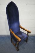 A LATE 20TH CENTURY OAK TALL THRONE CHAIR, with blue upholstery, scrolled open armrests, cylindrical