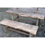 A RUSTIC LIVE EDGE GARDEN TABLE, length 124cm x depth 65cm x height 72cm, and two sized benches, max