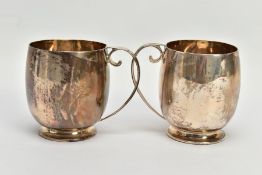 A PAIR OF SILVER CUPS, each of a plain polished design, personal engraving reads 'M.C & M.T.G.S
