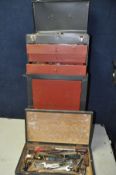 A METAL STORAGE CABINET/TOOLBOX comprising a three draw top box with opening lid above a single door