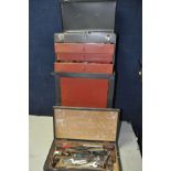 A METAL STORAGE CABINET/TOOLBOX comprising a three draw top box with opening lid above a single door