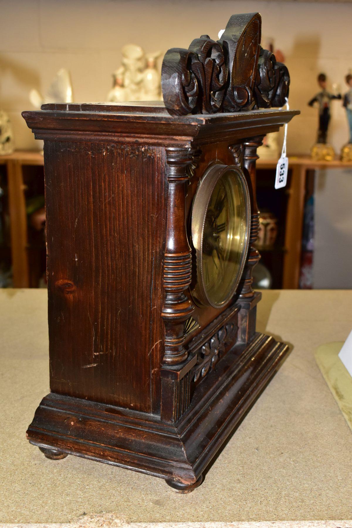 A LATE 19TH CENTURY WALNUT AND STAINED MANTEL CLOCK, foliate carved pediment, printed dial with - Bild 5 aus 6