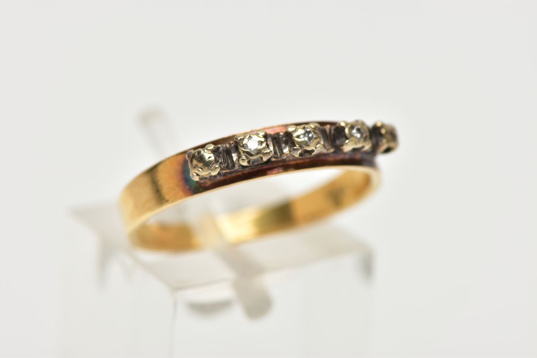 A YELLOW METAL DIAMOND HALF ETERNITY RING, the three illusion set diamonds to the metal capped sides - Image 4 of 4