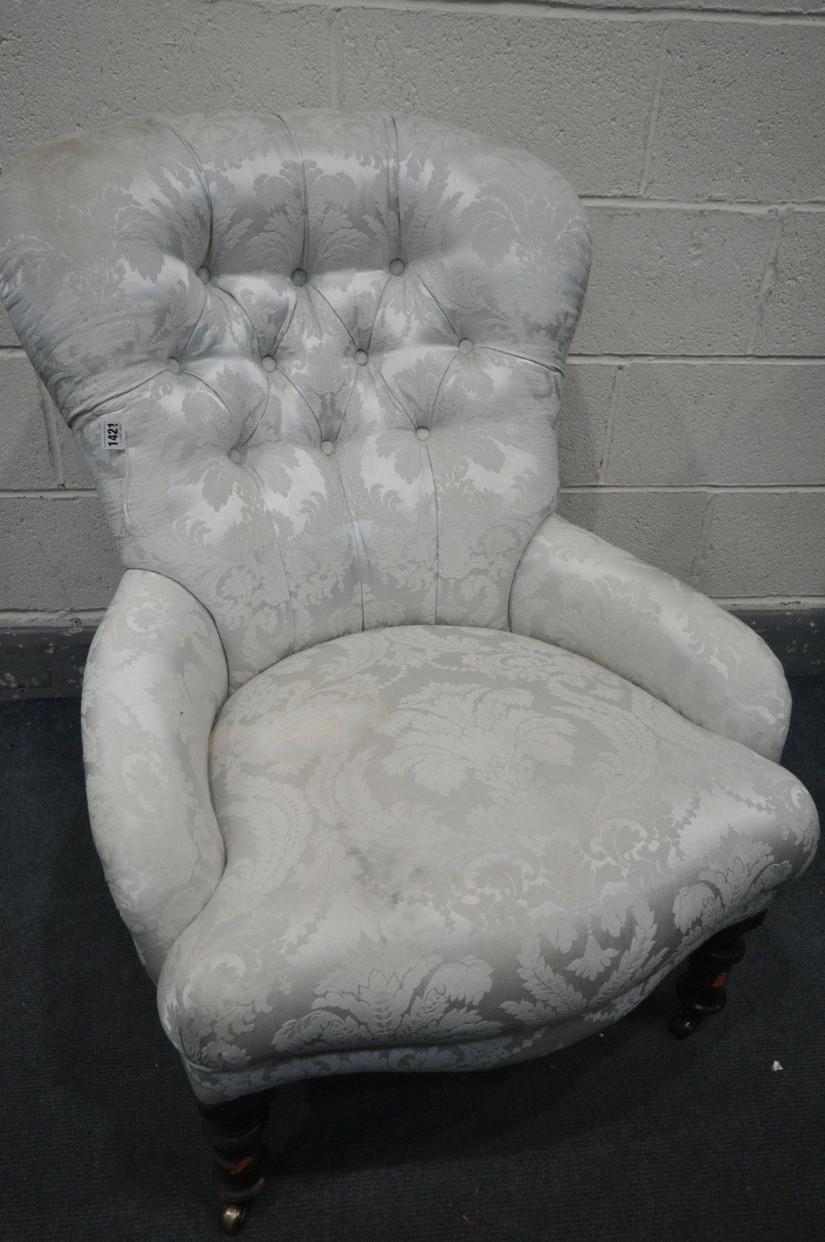 A VICTORIAN SPOON BACK CHAIR, with ice blue and floral upholstery, on turned front legs and brass