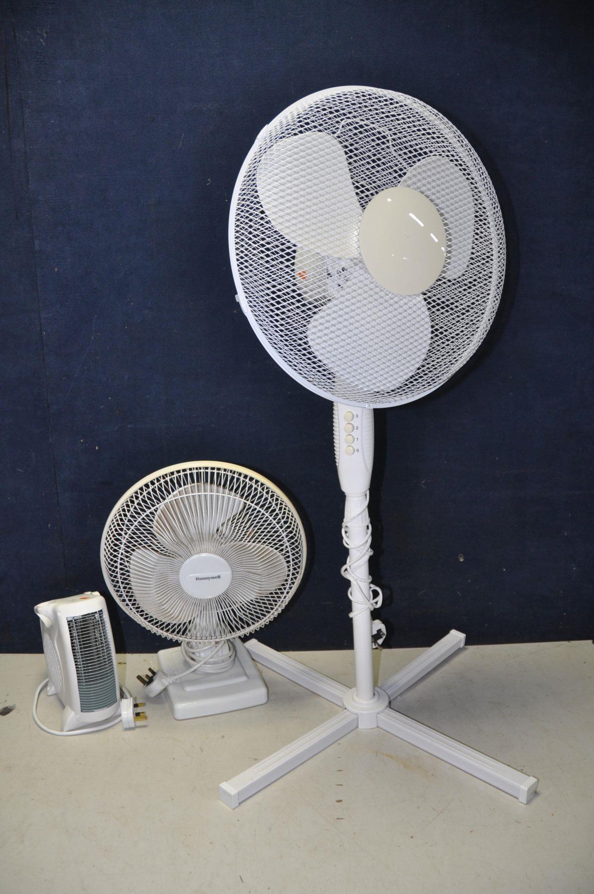 THREE FANS to include a unbranded 16in standing fan model No FS40-8JC, a Honeywell desk fan model No