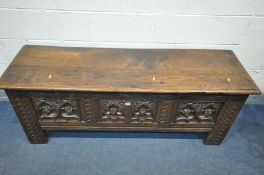 A LONG OAK ECCLESIASTICAL COFFER, including antique timbers, the front and sides with quatrefoils