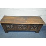 A LONG OAK ECCLESIASTICAL COFFER, including antique timbers, the front and sides with quatrefoils