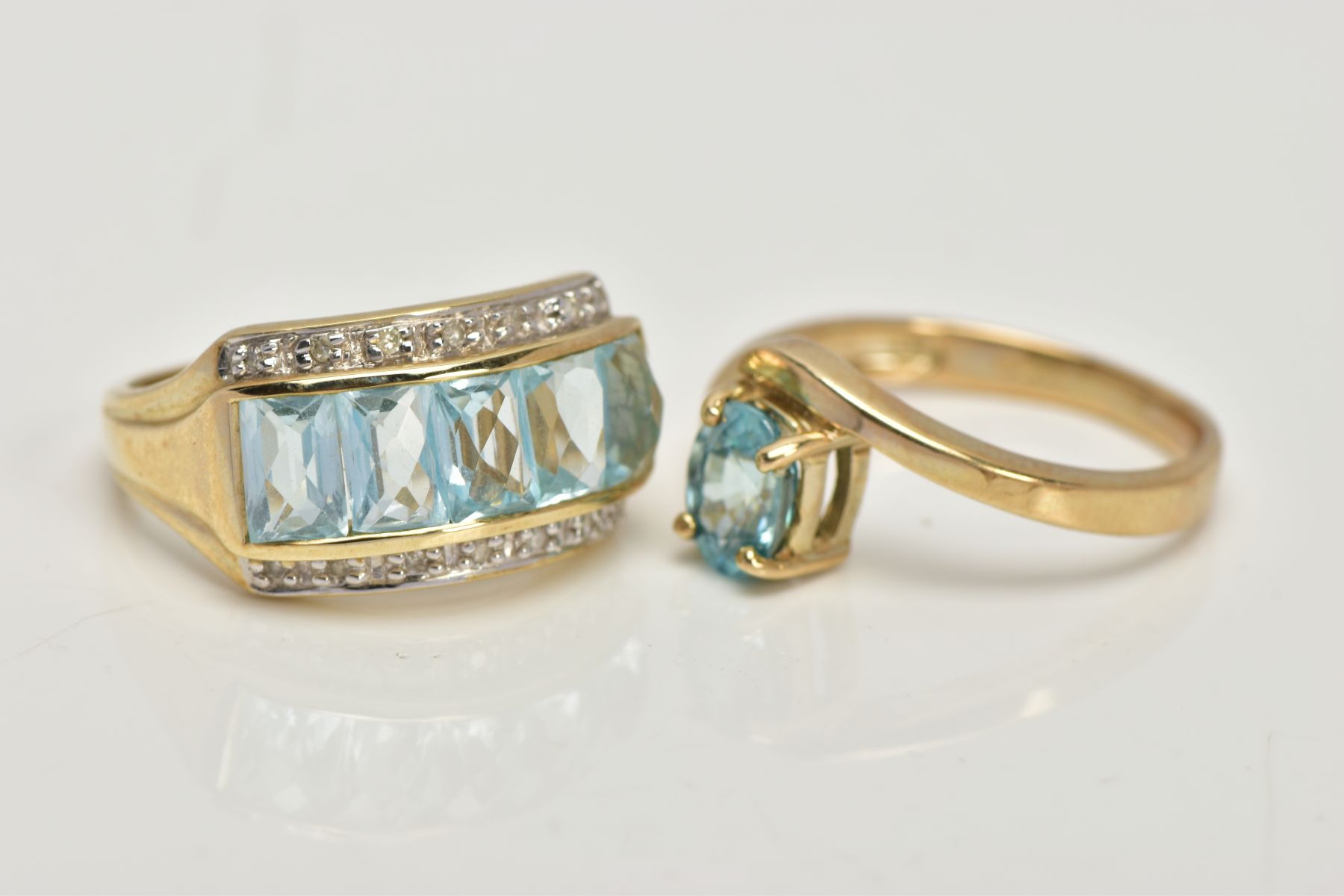 TWO 9CT GOLD GEM SET DRESS RINGS, the first centring on a slightly raised row of five rectangular, - Image 2 of 4