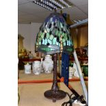 A TALL MODERN TIFFANY STYLE LAMP, with a green glass shade decorated with dragonflies and glass