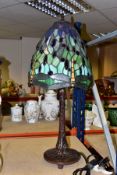 A TALL MODERN TIFFANY STYLE LAMP, with a green glass shade decorated with dragonflies and glass