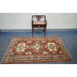 AN EDWARDIAN MAHOGANY PIANO STOOL, and a Turkish Kazak rug, 84cm x 111cm (2)