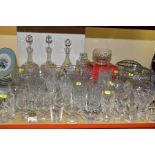 A COLLECTION OF CRYSTAL AND OTHER GLASSWARE, including a pair of decanters with original stoppers (